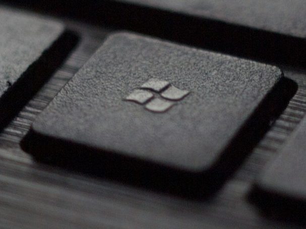 microsoft 365 and email support Close-up of a black keyboard key featuring the Windows logo.