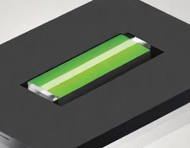 battery replacement Green rectangular object placed on a black surface with a cut-out frame.